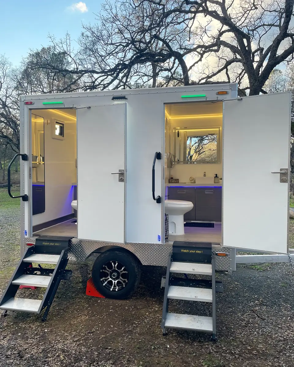 Restroom trailer lit at dusk