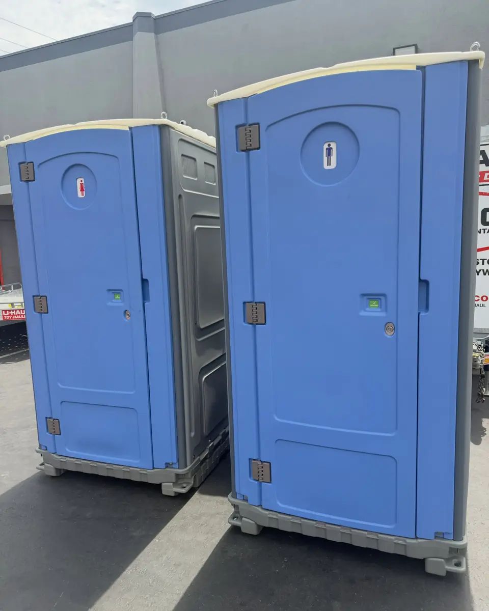 Two portable toilets standing side by side